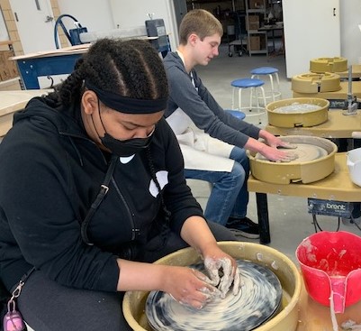 Working the pottery wheel